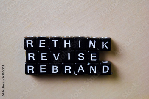 Reflect - Rethink - Rebrand on wooden blocks. Business and inspiration concept photo