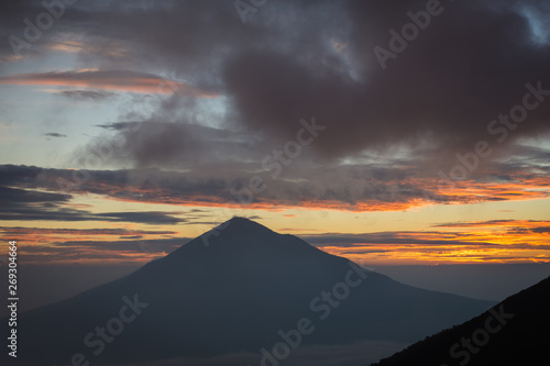 Warm morning sunrise on Tebing Soni with view of mount Cikuray. Beautiful landscape of mount Papandayan. Papandayan Mountain is one of the favorite place to hike on Garut.