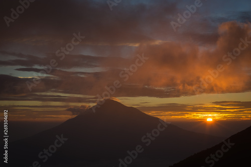 Warm morning sunrise on Tebing Soni with view of mount Cikuray. Beautiful landscape of mount Papandayan. Papandayan Mountain is one of the favorite place to hike on Garut.