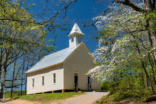 Little white church in the Smokies surrounded with Dogwood blooms.
