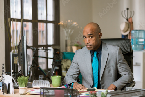 Skeptical Man in a Creative Office