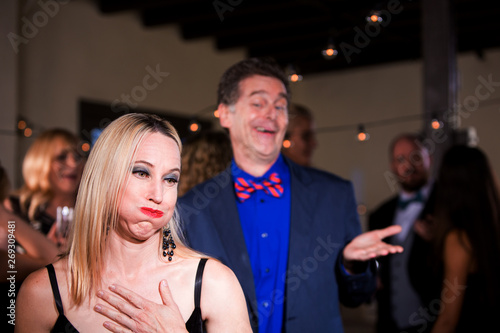 Woman at Party Disgusted with Boorish Man © Scott Griessel