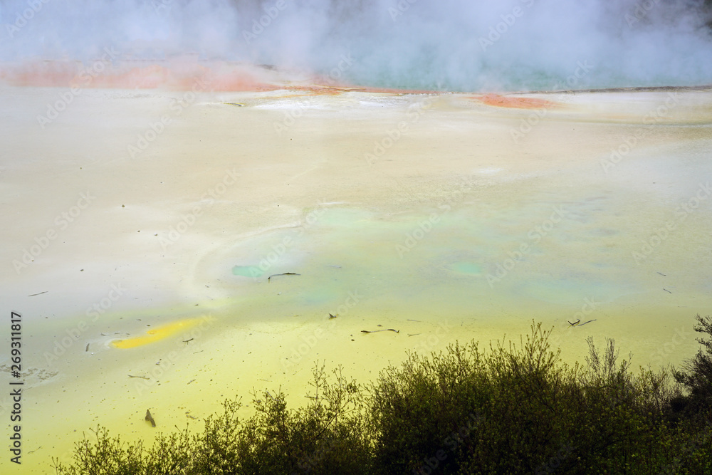 Crater filled with geothermal green waters in the Waiotapu area of the Taupo Volcanic Zone in New Zealand