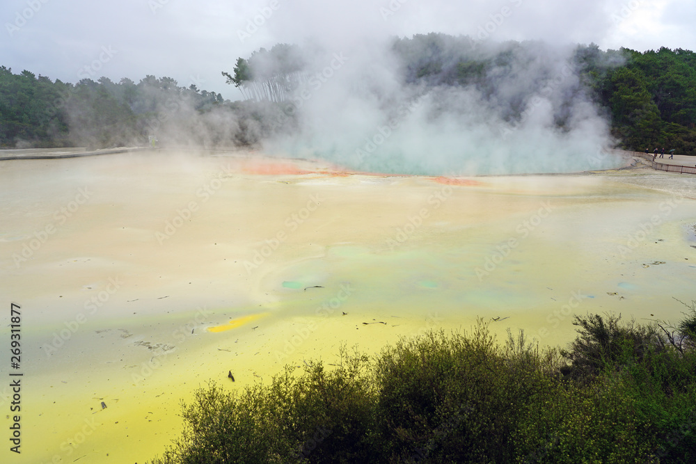 Crater filled with geothermal green waters in the Waiotapu area of the Taupo Volcanic Zone in New Zealand