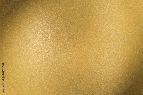 Brushed golden metal sheet surface, abstract texture background