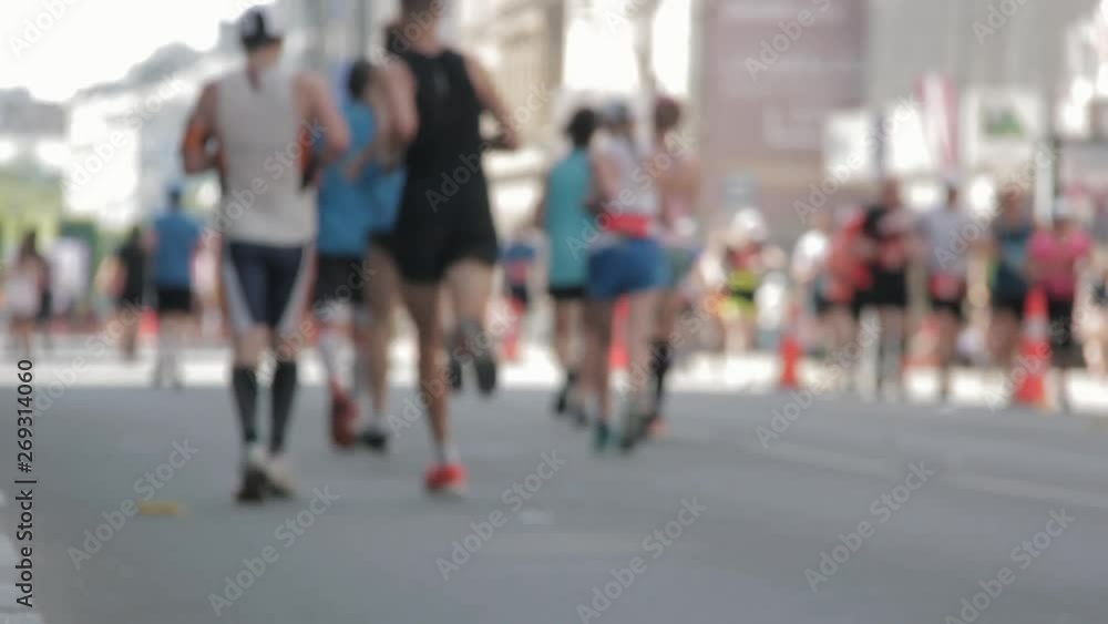 Marathon Runners Crowd Bottom-view Legs. Athletes Runing Out Off Focuss. Blurred Runner Feet Running Marathon. Marathon Runners Crowd Bottom-view Legs. Athletes Runing Out Off Focuss. Blurred Runner Feet Running Marathon.