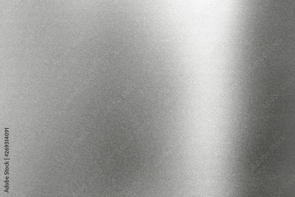 Light shining on rough gray metal wall, abstract texture background Light shining on rough gray metal wall, abstract texture background