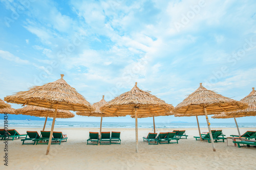 White sand beach with relaxing chairs