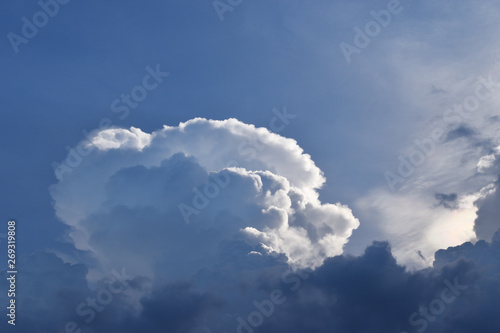 Cumulonimbus cloud formations on tropical blue sky , Nimbus moving , Abstract background from natural phenomenon and gray clouds hunk , Thailand