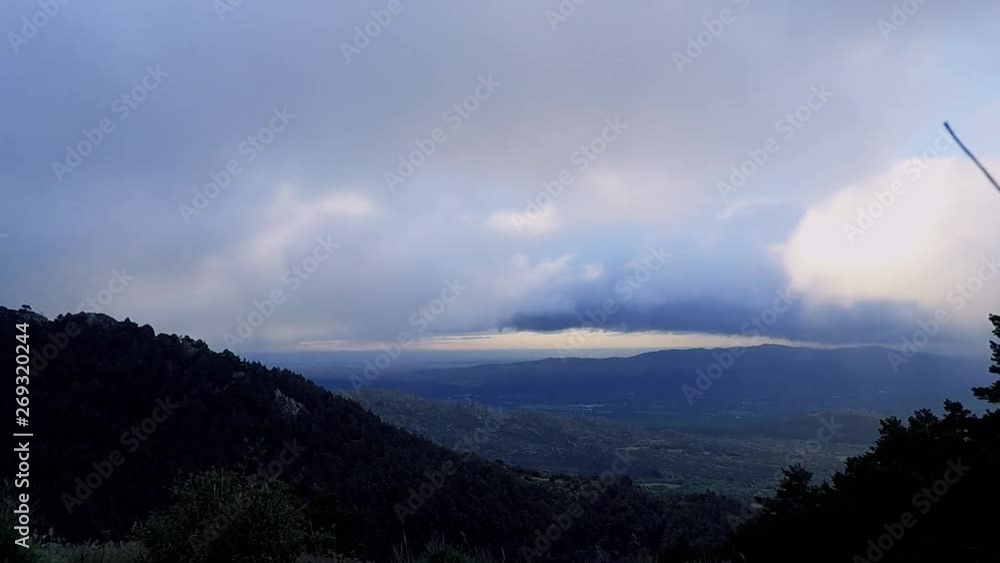 A time lapse of a valley plenty of clouds from the top of a mountain A time lapse of a valley plenty of clouds from the top of a mountain