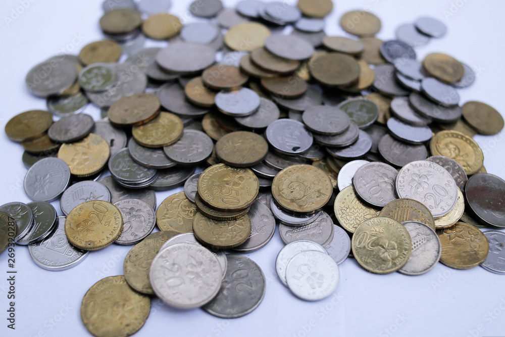 Malaysian coins close up over white background Malaysian coins close up over white background