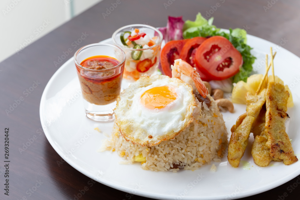 Fried rice with fried egg With roasted pork and salad