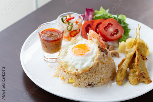 Fried rice with fried egg With roasted pork and salad