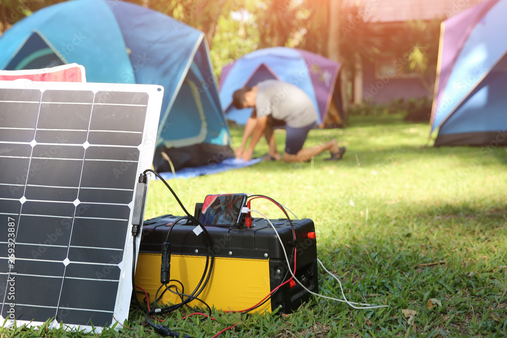 Solar Chargers for Camping, Power Box Battery Camping and Flexible solar  panels Stock Photo | Adobe Stock
