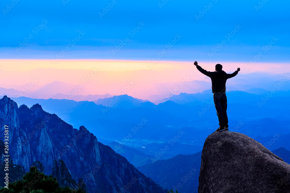 Happy man gesture of triumph with hands in the air,conceptual scene Happy man gesture of triumph with hands in the air,conceptual scene