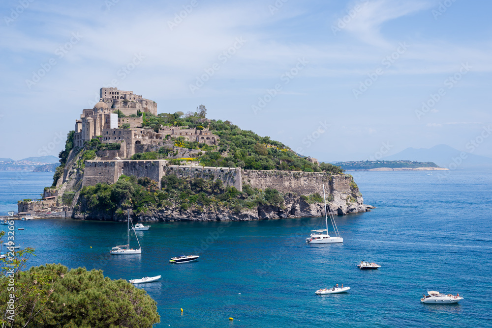 Ancient castle on the island in the blue sea Ischia Italy