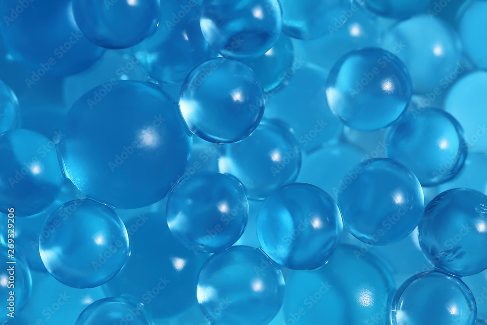 Water blue gel balls. Polymer gel. Silica gel. Balls of blue hydrogel. Crystal liquid ball with reflection. Texture background. Close up macro Water blue gel balls. Polymer gel. Silica gel. Balls of blue hydrogel. Crystal liquid ball with reflection. Texture background. Close up macro