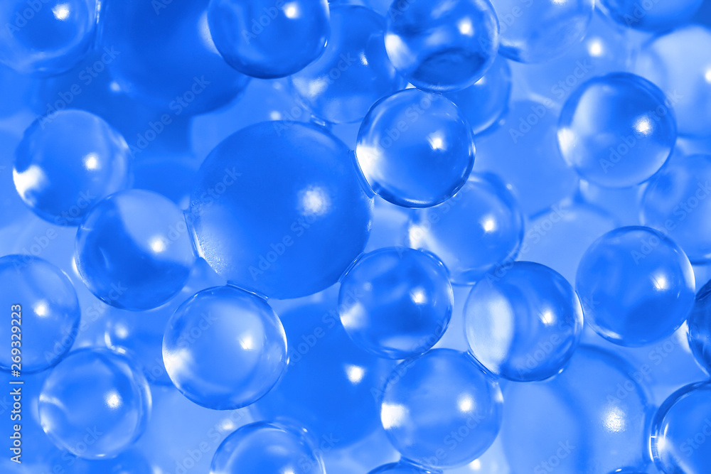 Water blue gel balls. Polymer gel. Silica gel. Balls of blue hydrogel. Crystal liquid ball with reflection. Texture background. Close up macro Water blue gel balls. Polymer gel. Silica gel. Balls of blue hydrogel. Crystal liquid ball with reflection. Texture background. Close up macro