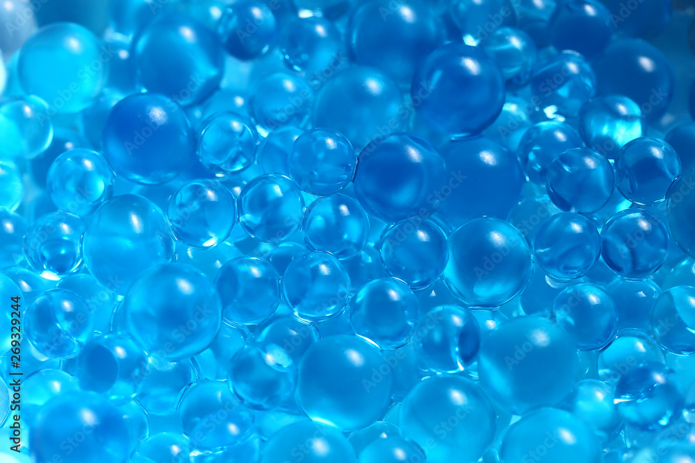 Water blue gel balls. Polymer gel. Silica gel. Balls of blue hydrogel. Crystal liquid ball with reflection. Texture background. Close up macro Water blue gel balls. Polymer gel. Silica gel. Balls of blue hydrogel. Crystal liquid ball with reflection. Texture background. Close up macro