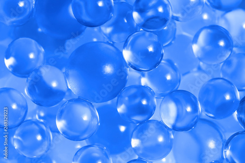 Water blue gel balls. Polymer gel. Silica gel. Balls of blue hydrogel. Crystal liquid ball with reflection. Texture background. Close up macro