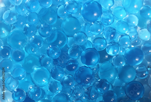 Water blue gel balls. Polymer gel. Silica gel. Balls of blue hydrogel. Crystal liquid ball with reflection. Texture background. Close up macro