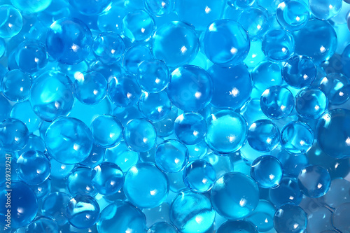 Water blue gel balls. Polymer gel. Silica gel. Balls of blue hydrogel. Crystal liquid ball with reflection. Texture background. Close up macro