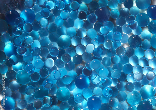 Water blue gel balls. Polymer gel. Silica gel. Balls of blue hydrogel. Crystal liquid ball with reflection. Texture background. Close up macro