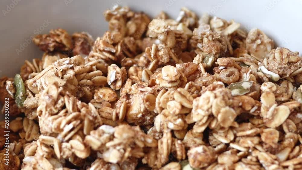 Cornflakes whole grain cereal closed up, slow motion. Cornflakes whole grain cereal closed up, slow motion.