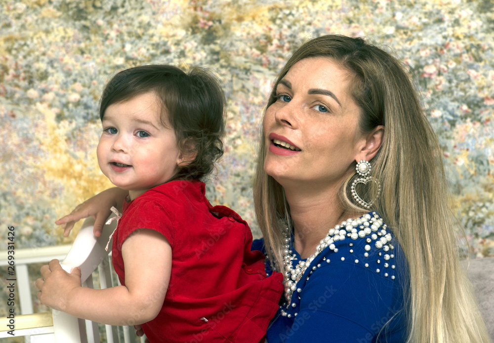 Portrait of a young mother with a little daughter Portrait of a young mother with a little daughter