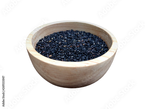 Raw black sesame seed in wooden cup isolated on white background. 