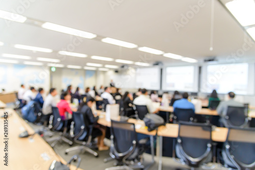 Abstract blurred image of conference and presentation in the meeting room