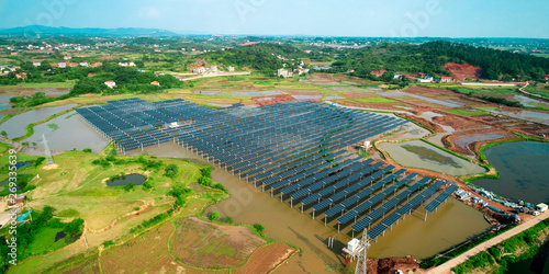 Aerial photography of solar photovoltaic panels built on the surface of the water