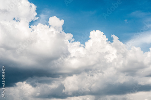 fluffy white cloud on air clear blue sky weather background. high contrast