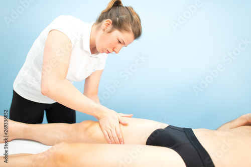 Quadriceps massage in a physiotherapist's studio