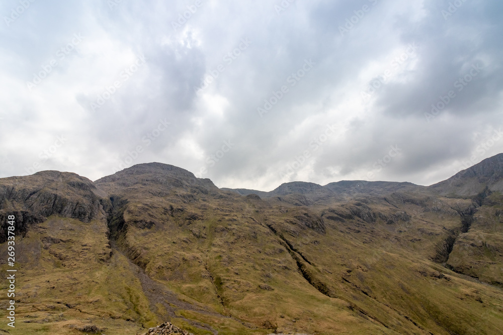 View of Lingmell and Scafell Pike with Dramatic Grey Clouds, Lake District, England, UK View of Lingmell and Scafell Pike with Dramatic Grey Clouds, Lake District, England, UK