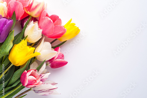 Fototapeta Naklejka Na Ścianę i Meble -  bright spring bouquet of multi-colored tulips on a white background