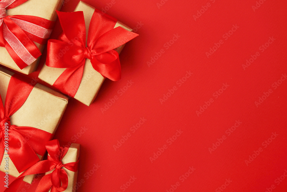 Wrapped presents with bright red background with copy space