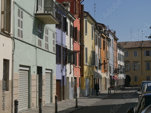 Fototapeta Naklejka Na Ścianę i Meble -  Colored houses in Parma. Colored houses along the street Borgo del Correggio in the historic center of Parma.