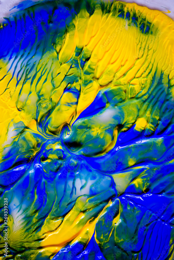 Dynamic fluid color paint splashes background. Blue and orange mixed liquid backdrop. Abstract marbling effect. Dynamic fluid