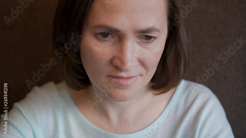 Portrait of a woman looking at the screen of a smartphone. photo