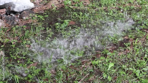 rain drop down on ground from eaves above in rainy day