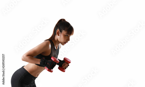Portrait of sexy young Asian woman with dumbbell on hand in sport uniform during training on white background.