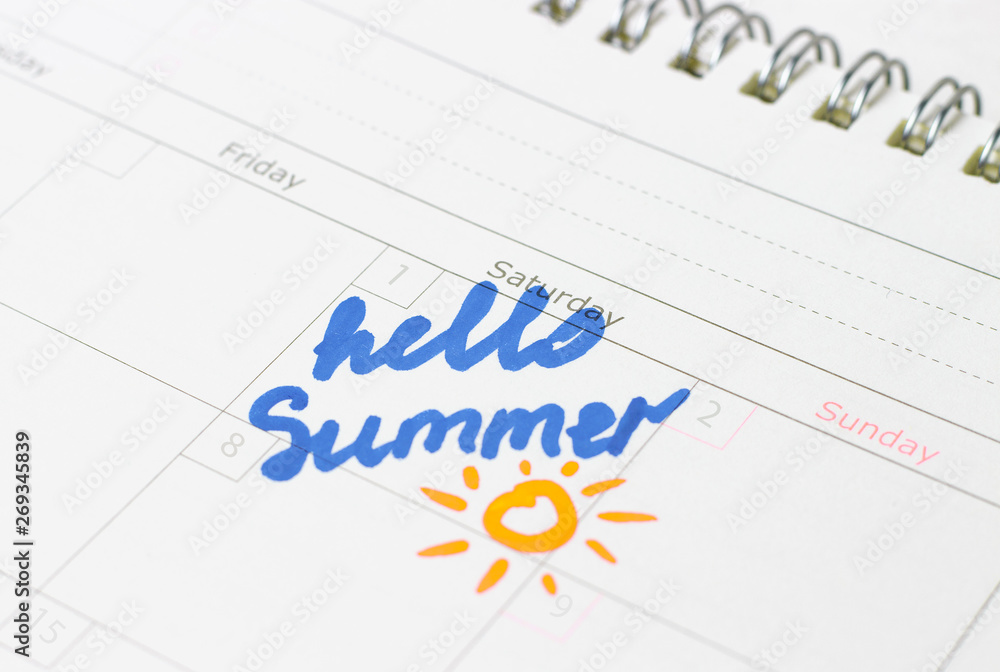Inscription hello summer in the calendar, close up Inscription hello summer in the calendar, close up