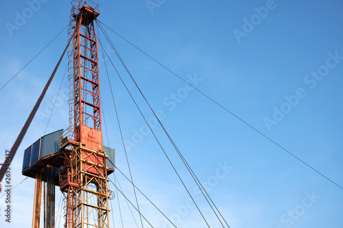 part of the rig in action with pipes in the evening