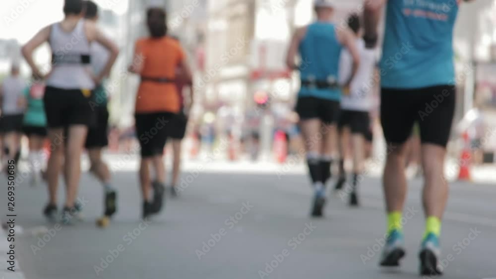 Marathon Runners Crowd Bottom-view Legs. Athletes Runing Out Off Focuss. Blurred Runner Feet Running Marathon. Tet Riga Marathon Latvia Marathon Runners Crowd Bottom-view Legs. Athletes Runing Out Off Focuss. Blurred Runner Feet Running Marathon. Tet Riga Marathon Latvia