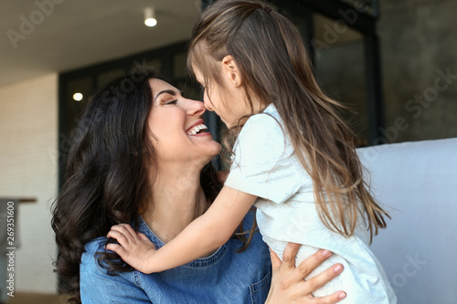 Portrait of happy mother an...
