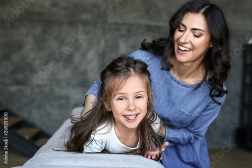 Happy mother and daughter h...