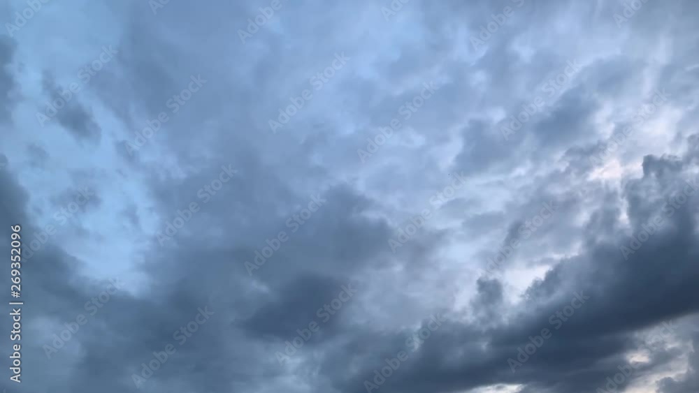 Timelapse Dark rain clouds pass by during the sunset Timelapse Dark rain clouds pass by during the sunset