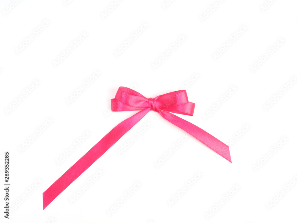 Pink satin ribbon bow with double loops on white background Pink satin ribbon bow with double loops on white background