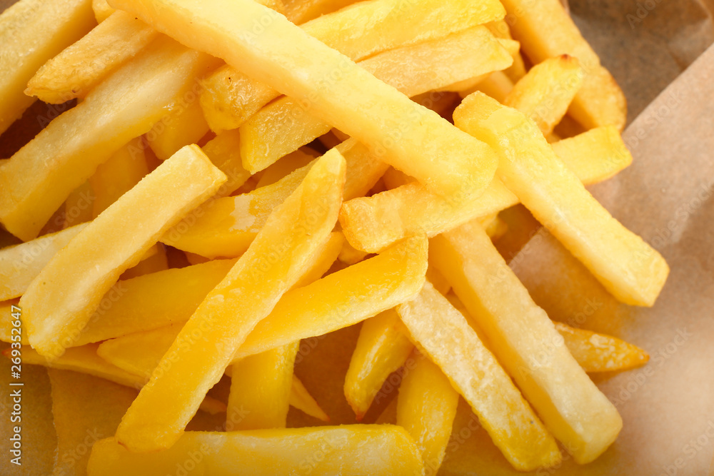Tasty crispy french fries, closeup Tasty crispy french fries, closeup